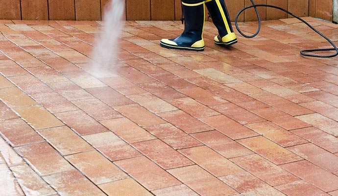 professional man wear uniform concrete and brick cleaning